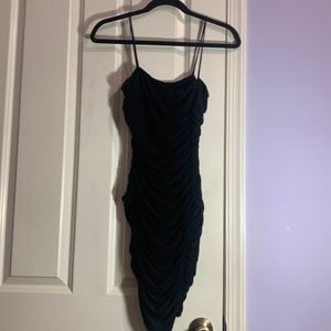Black mini dress with ruching.